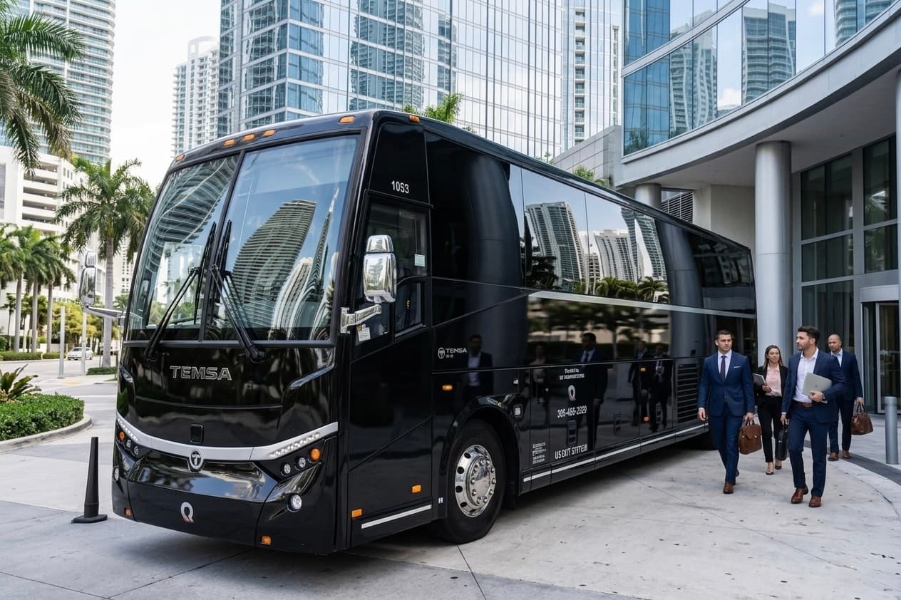 Corporate team boarding a Miami Bus Company motorcoach for a company event