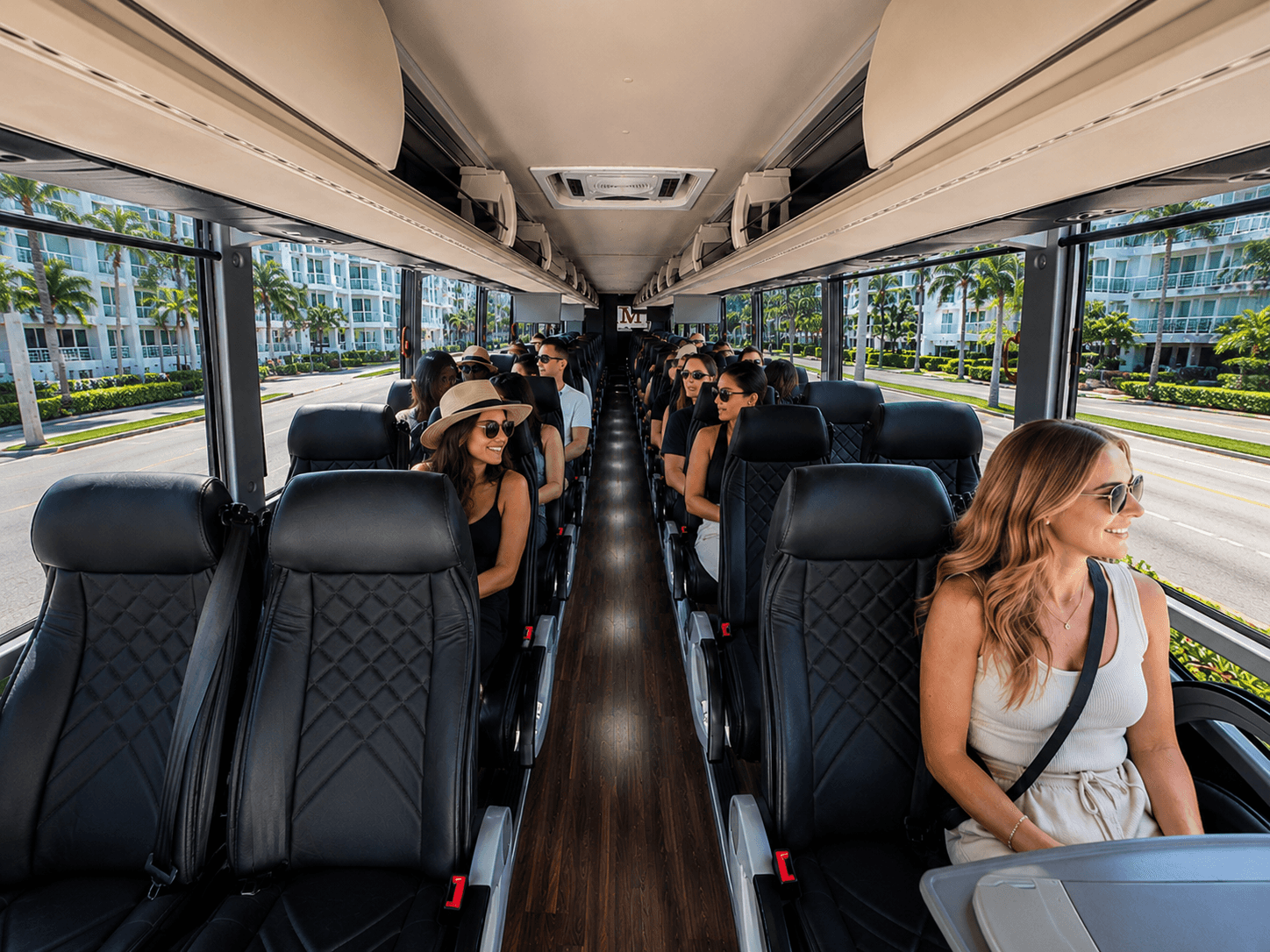 Guests seated aboard a Miami Bus Company motorcoach during a private group sightseeing tour